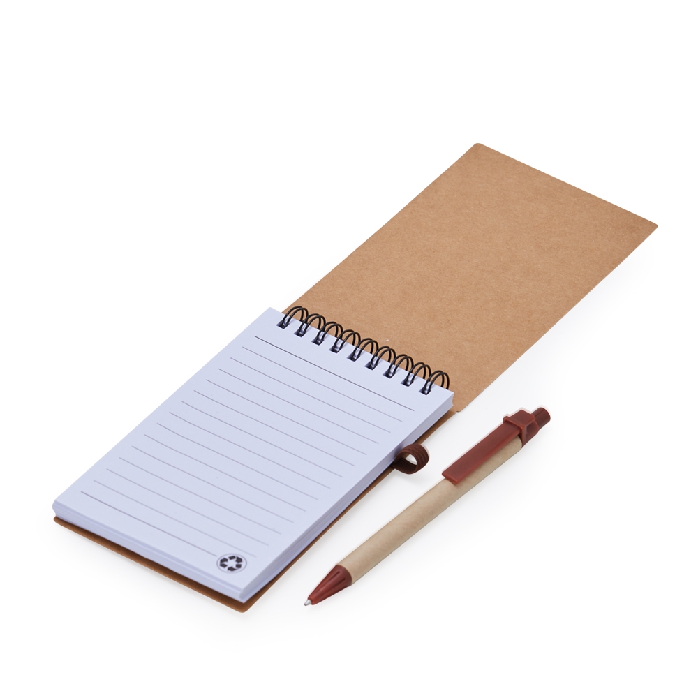 Caderno Pau-Brasil aberto com miolo pautado e caneta ecológica