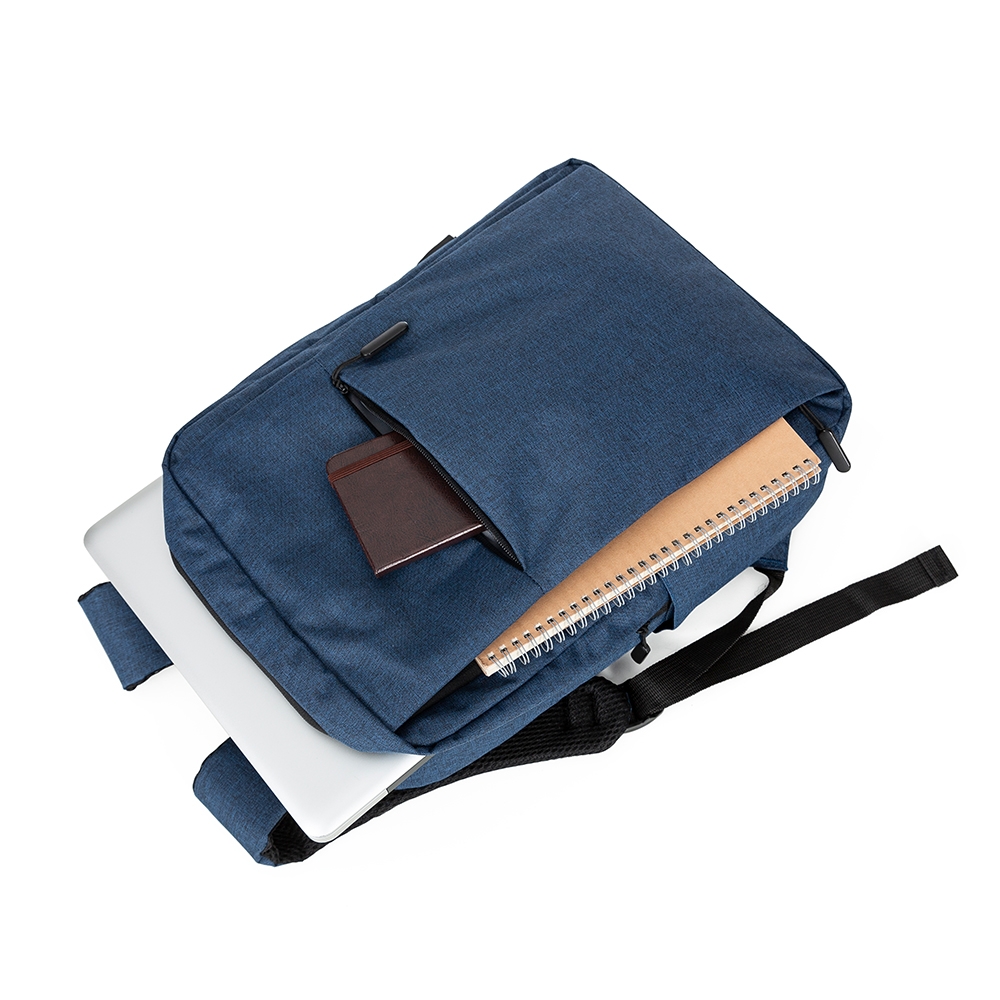 Mochila Minuano azul aberta com notebook e caderno
